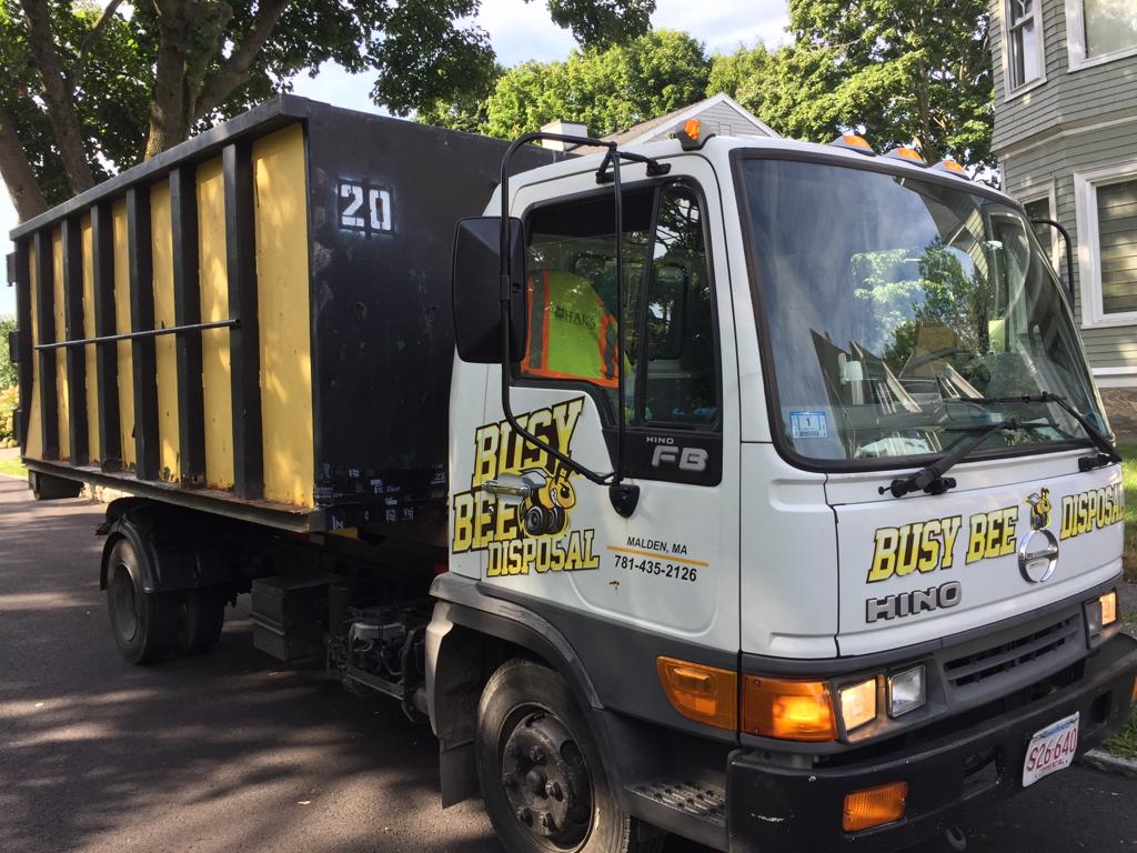 Busy Bee Disposal - company truck, black white and yellow
