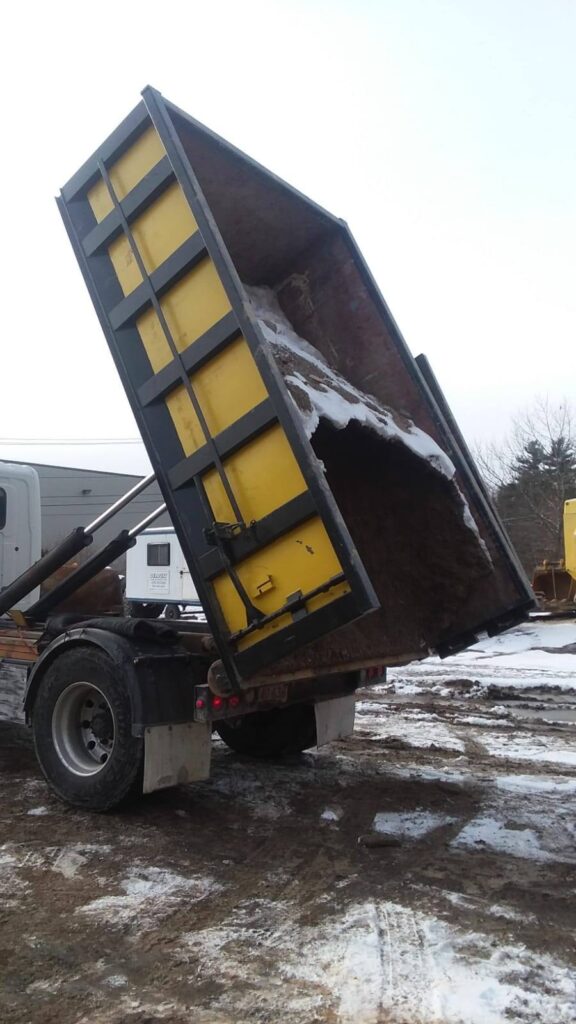 roll-off dumpster unloading