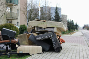 old furniture sitting on a sidewalk