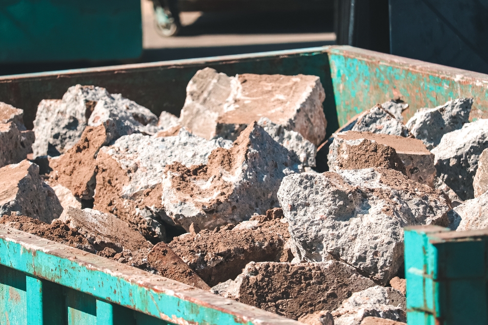 heavy rocks in dumpster