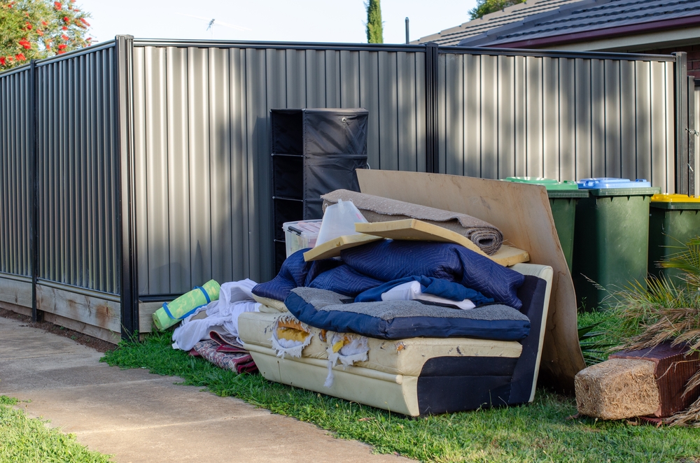 Junk outside of house sitting on lawn